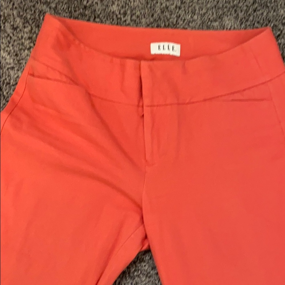 Peach colored Capri pants.